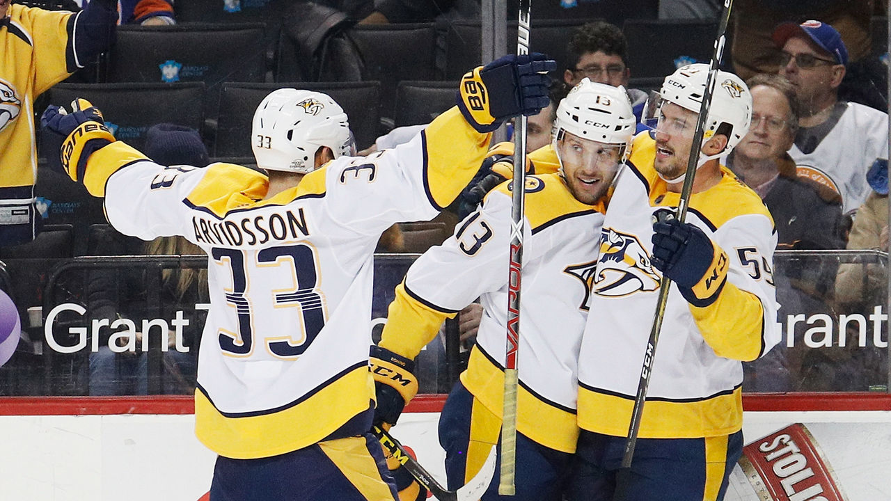 NEW YORK, NY - FEBRUARY 05: Roman Josi #59 of the Nashville Predators celebrates his game-winning goal in overtime against the New York Islanders with teammates Viktor Arvidsson #33 and Nick Bonino #13 on February 5, 2018 at Barclays Center in the Brooklyn borough of New York City.