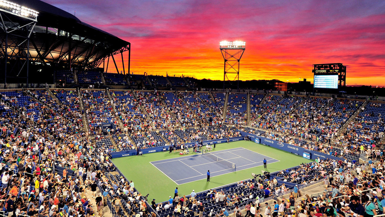 NEW YORK, NY - SEPTEMBER 02: The sun sets over Louis Armstrong Stadium during the third round Men's Singles match between John Isner of the United States and Kyle Edmund of Great Britain on Day Five of the 2016 US Open at the USTA Billie Jean King National Tennis Center on September 2, 2016 in the Flushing neighborhood of the Queens borough of New York City.