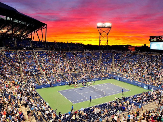 NEW YORK, NY - SEPTEMBER 02: The sun sets over Louis Armstrong Stadium during the third round Men's Singles match between John Isner of the United States and Kyle Edmund of Great Britain on Day Five of the 2016 US Open at the USTA Billie Jean King National Tennis Center on September 2, 2016 in the Flushing neighborhood of the Queens borough of New York City.