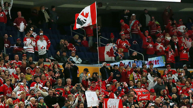 BUFFALO, NY - JANUARY 5: Fans raise the flag of Canada after a goal against Sweden during the Gold medal game of the IIHF World Junior Championship at KeyBank Center on January 5, 2018 in Buffalo, New York. Canada beat Sweden 3-1. *** Local Caption ***