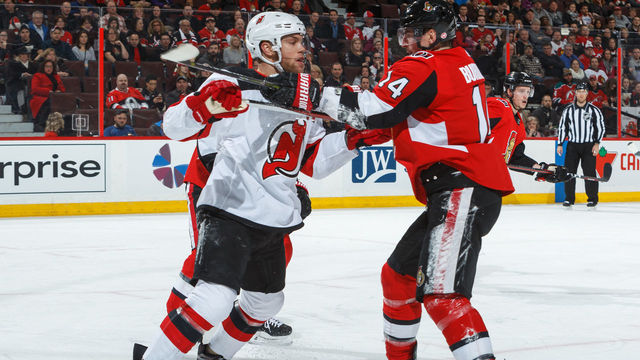 OTTAWA, ON - FEBRUARY 7: Alexandre Burrows #14 of the Ottawa Senators battles for position against Taylor Hall #9 of the New Jersey Devils at Canadian Tire Centre on February 7, 2018 in Ottawa, Ontario, Canada.