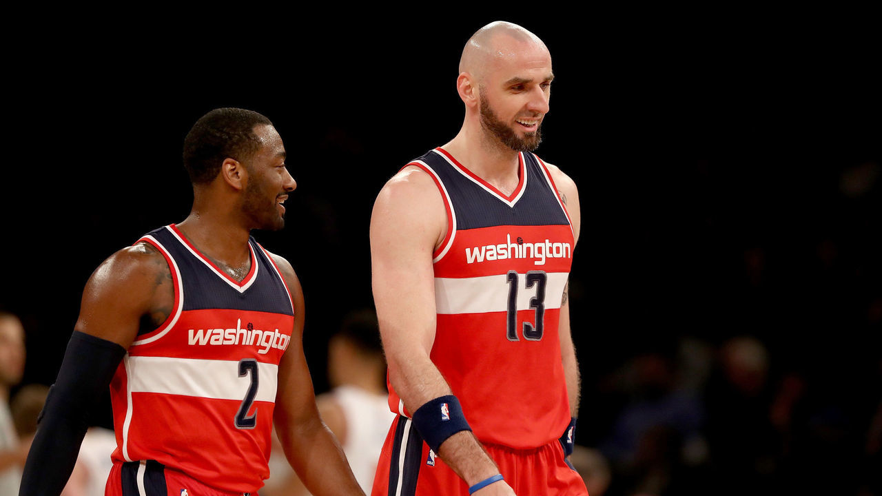 NEW YORK, NY - APRIL 06: John Wall #2 and Marcin Gortat #13 of the Washington Wizards celebrate during a time out against the New York Knicks at Madison Square Garden on April 6, 2017 in New York City.