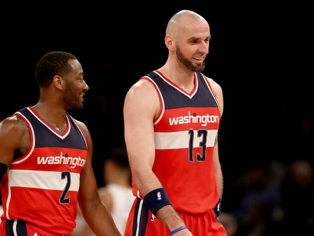 NEW YORK, NY - APRIL 06: John Wall #2 and Marcin Gortat #13 of the Washington Wizards celebrate during a time out against the New York Knicks at Madison Square Garden on April 6, 2017 in New York City.