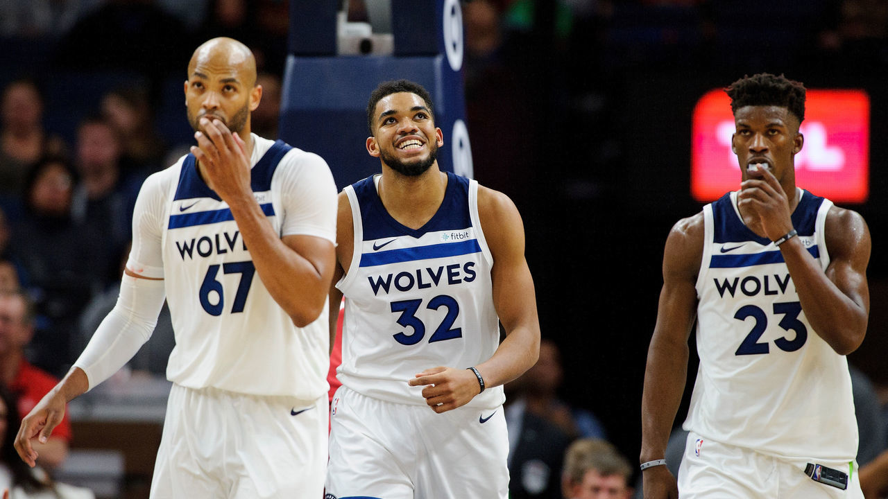 MINNEAPOLIS, MN - NOVEMBER 24: Taj Gibson #67, Karl-Anthony Towns #32 and Jimmy Butler #23 of the Minnesota Timberwolves look on during the game against the Miami Heat on November 24, 2017 at the Target Center in Minneapolis, Minnesota.