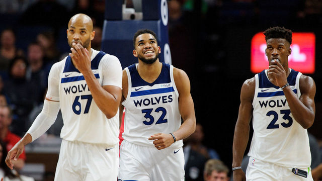 MINNEAPOLIS, MN - NOVEMBER 24: Taj Gibson #67, Karl-Anthony Towns #32 and Jimmy Butler #23 of the Minnesota Timberwolves look on during the game against the Miami Heat on November 24, 2017 at the Target Center in Minneapolis, Minnesota.