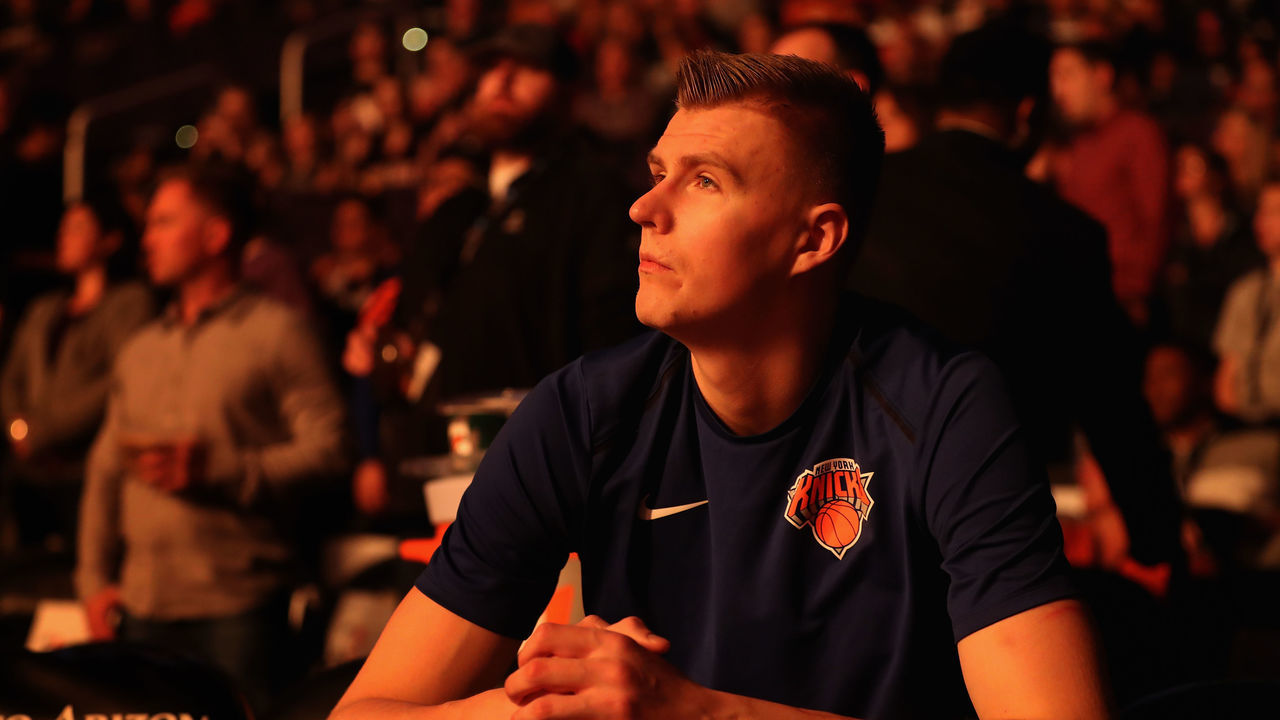 PHOENIX, AZ - JANUARY 26: Kristaps Porzingis #6 of the New York Knicks sits on the bench before the start of the NBA game against the Phoenix Suns at Talking Stick Resort Arena on January 26, 2018 in Phoenix, Arizona.