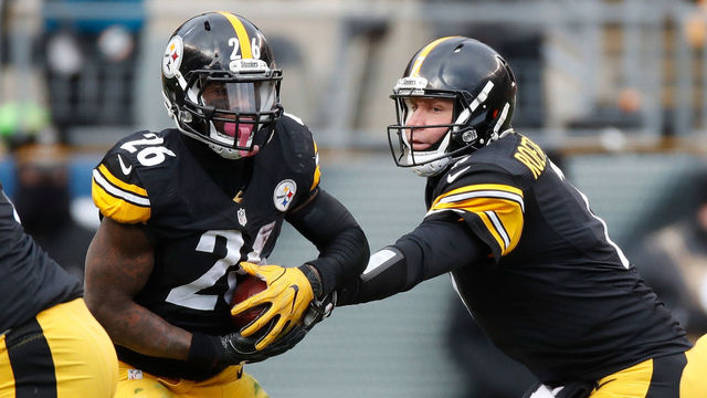 PITTSBURGH, PA - JANUARY 08: Ben Roethlisberger #7 of the Pittsburgh Steelers hands off to Le'Veon Bell #26 during the second quarter against the Miami Dolphins in the AFC Wild Card game at Heinz Field on January 8, 2017 in Pittsburgh, Pennsylvania.