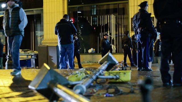 PHILADELPHIA, PA - FEBRUARY 05: philadelphia police officers try to keep fans away after broken macy's store windows while celebrating the Philadelphia Eagles' victory in Super Bowl LII game against the New England Patriots on February 5, 2018 in Philadelphia, Pennsylvania..