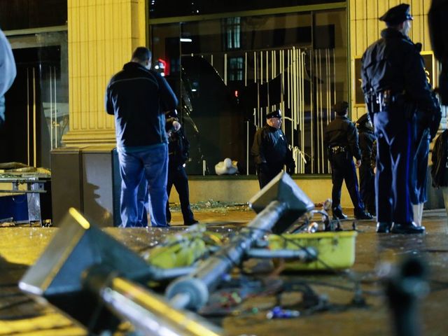 PHILADELPHIA, PA - FEBRUARY 05: philadelphia police officers try to keep fans away after broken macy's store windows while celebrating the Philadelphia Eagles' victory in Super Bowl LII game against the New England Patriots on February 5, 2018 in Philadelphia, Pennsylvania..