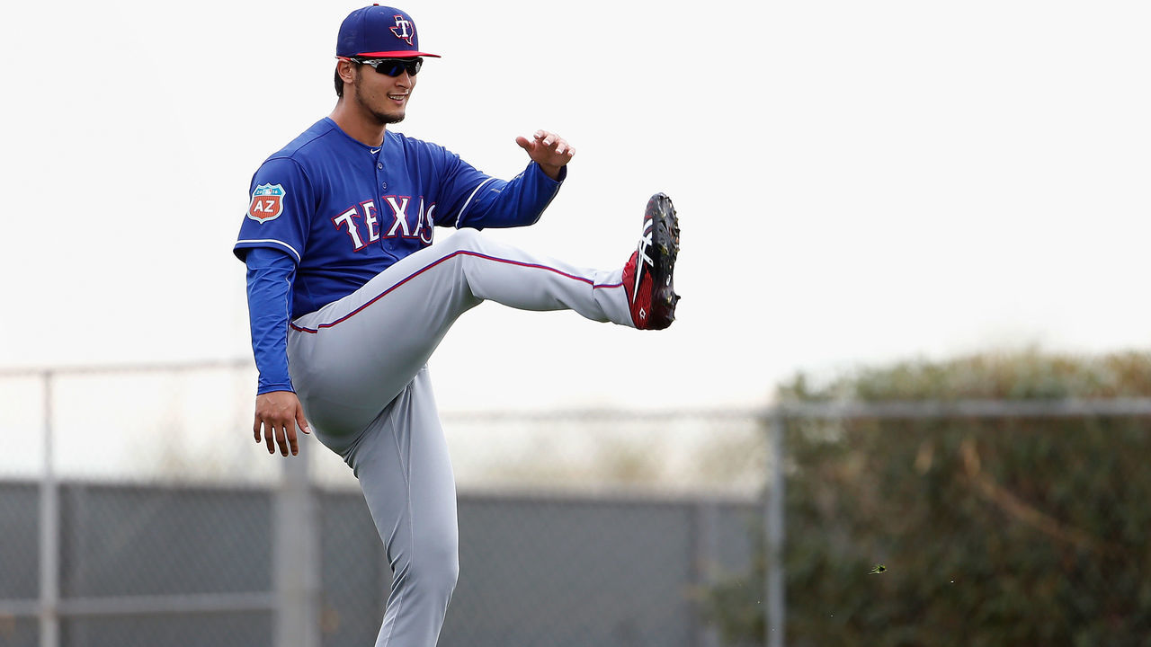 SURPRISE, AZ - FEBRUARY 19: Starting pitcher Yu Darvish #11 of the Texas Rangers participates in a spring training workout at Surprise Stadium on February 19, 2016 in Surprise, Arizona.
