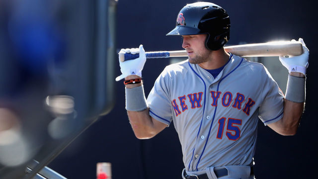 PEORIA, AZ - OCTOBER 13: Tim Tebow #15 (New York Mets) of the Scottsdale Scorpions warms up in the dugout during the Arizona Fall League game against the Peoria Javelinas at Peoria Stadium on October 13, 2016 in Peoria, Arizona.