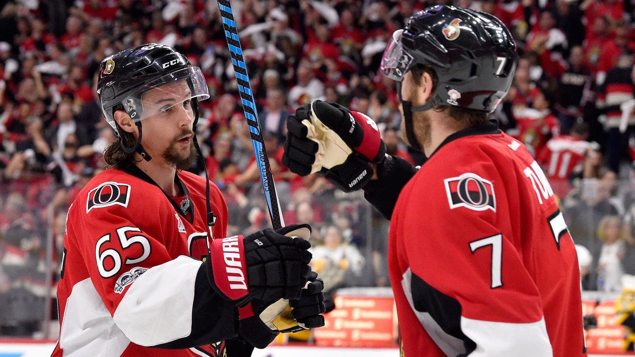 OTTAWA, ON - MAY 23: Erik Karlsson #65 of the Ottawa Senators celebrates with Kyle Turris #7 after defeating the Pittsburgh Penguins with a score of 2 to 1 in Game Six of the Eastern Conference Final during the 2017 NHL Stanley Cup Playoffs at Canadian Tire Centre on May 23, 2017 in Ottawa, Canada.