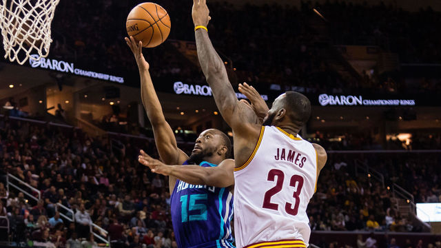 CLEVELAND, OH - NOVEMBER 13: Kemba Walker #15 of the Charlotte Hornets shoots while under pressure from LeBron James #23 of the Cleveland Cavaliers during the first half at Quicken Loans Arena on November 13, 2016 in Cleveland, Ohio. NOTE TO USER: User expressly acknowledges and agrees that, by downloading and/or using this photograph, user is consenting to the terms and conditions of the Getty Images License Agreement. Mandatory copyright notice.