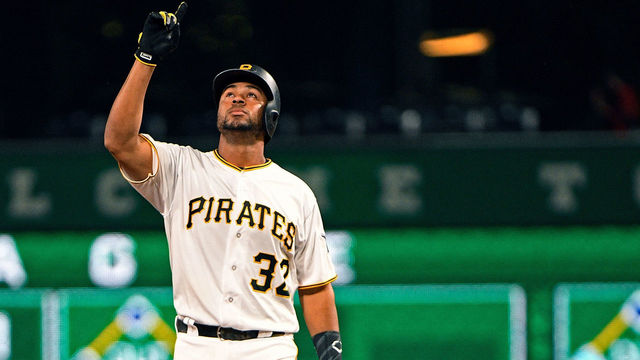 PITTSBURGH, PA - SEPTEMBER 20: Elias Diaz #32 of the Pittsburgh Pirates points to the sky after hitting a double in the third inning during the game against the Milwaukee Brewers at PNC Park on September 20, 2017 in Pittsburgh, Pennsylvania.