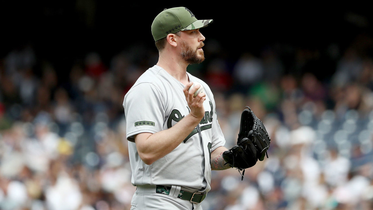 NEW YORK, NY - MAY 28: John Axford #61 of the Oakland Athletics reacts in the eighth inning against the New York Yankees on May 28, 2017 at Yankee Stadium in the Bronx borough of New York City.