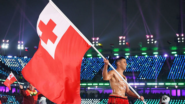 PYEONGCHANG-GUN, SOUTH KOREA - FEBRUARY 09: Flag bearer Pita Taufatofua of Tonga and teammates enter the stadium during the Opening Ceremony of the PyeongChang 2018 Winter Olympic Games at PyeongChang Olympic Stadium on February 9, 2018 in Pyeongchang-gun, South Korea.