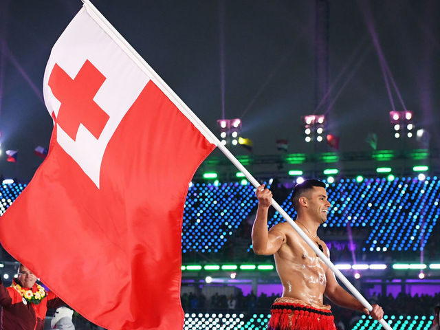 PYEONGCHANG-GUN, SOUTH KOREA - FEBRUARY 09: Flag bearer Pita Taufatofua of Tonga and teammates enter the stadium during the Opening Ceremony of the PyeongChang 2018 Winter Olympic Games at PyeongChang Olympic Stadium on February 9, 2018 in Pyeongchang-gun, South Korea.