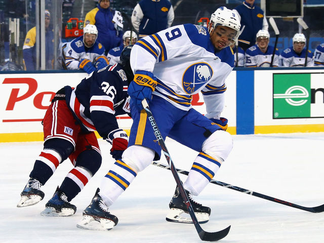 NEW YORK, NY - JANUARY 01: Evander Kane #9 of the Buffalo Sabres skates against the New York Rangers during the 2018 Bridgestone NHL Winter Classic at Citi Field on January 1, 2018 in the Flushing neighborhood of the Queens borough of New York City. The Rangers defeated the Sabres 3-2 in overtime.