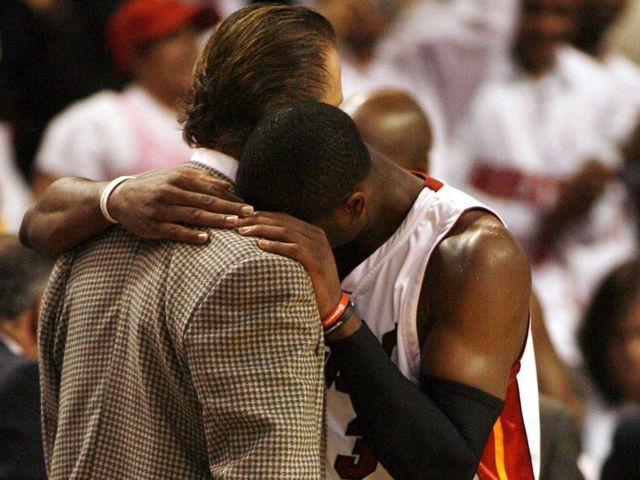 MIAMI - NOVEMBER 7: Guard Dwyane Wade #3 of the Miami Heat hugs Head Coach Pat Riley after defeating the Seattle SuperSonics on November 7, 2006 at the American Airlines Arena in Miami Florida. The Heat defeated the Sonics 90-87. NOTE TO USER: User expressly acknowledges and agrees that, by downloading and/or using this Photograph, User is consenting to the terms and conditions of the Getty Images License Agreement.