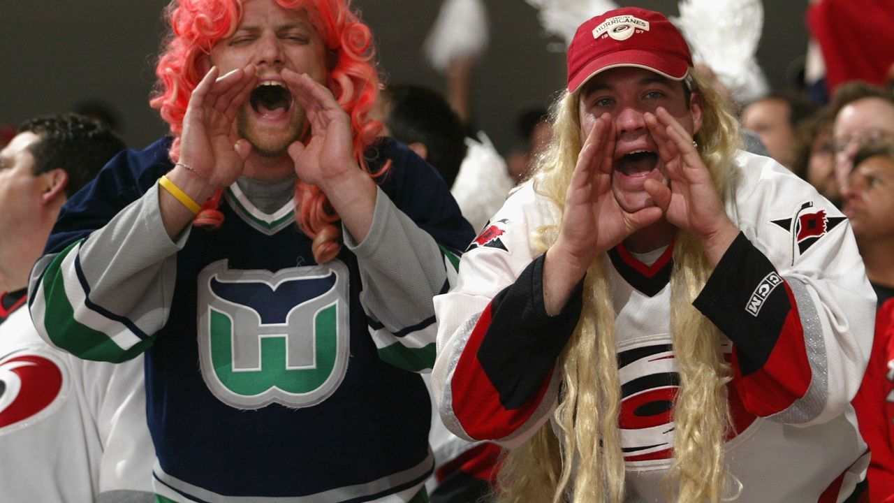 RALEIGH, NC - JUNE 14: Fans of the Carolina Hurricanes cheer during game five of the 2006 NHL Stanley Cup Finals against the Edmonton Oilers on June 14, 2006 at the RBC Center in Raleigh, North Carolina.