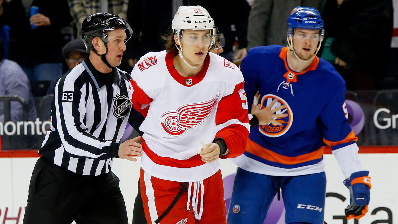 NEW YORK, NY - FEBRUARY 09: linesman Trent Knorr #63 escorts Tyler Bertuzzi #59 of the Detroit Red Wings off the ice following a major slashing penalty during the third period against the New York Islanders at Barclays Center on February 9, 2018 in New York City.
