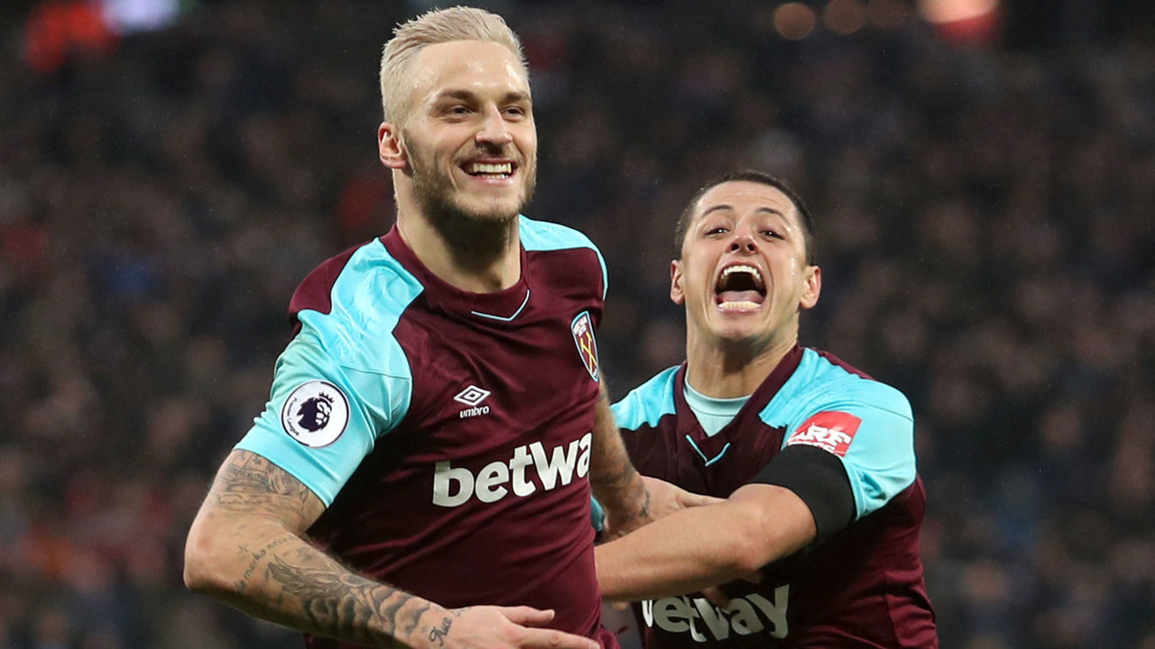 LONDON, ENGLAND - FEBRUARY 10: Marko Arnautovic of West Ham United celebrates with teammate Javier Hernandez after scoring his sides second goal during the Premier League match between West Ham United and Watford at London Stadium on February 10, 2018 in London, England.