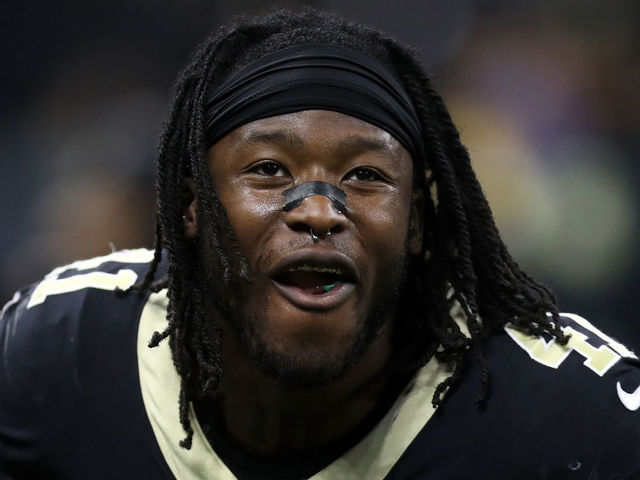 NEW ORLEANS, LA - JANUARY 07: Alvin Kamara #41 of the New Orleans Saints celebrates after a touchdown by eating Airheads candy on the sideline during the game against the Carolina Panthers at the Mercedes-Benz Superdome on January 7, 2018 in New Orleans, Louisiana.