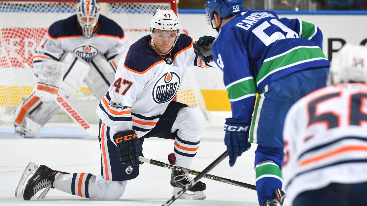EDMONTON, AB - SEPTEMBER 22: Keegan Lowe #47 of the Edmonton Oilers blocks a shot from Michael Carcone #58 of the Vancouver Canucks on September 22, 2017 at Rogers Place in Edmonton, Alberta, Canada.