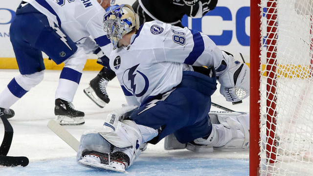 TAMPA, FL - FEBRUARY 10: Andrei Vasilevskiy #88 of the Tampa Bay Lightning makes a behind the back save against the Los Angeles Kings at the Amalie Arena on February 10, 2018 in Tampa, Florida.