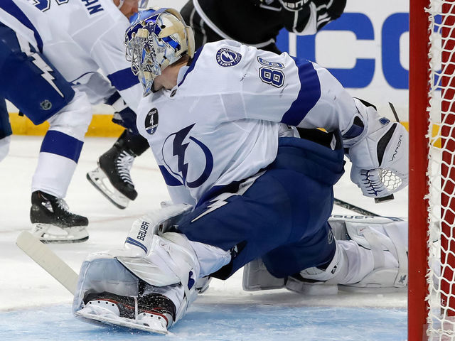 TAMPA, FL - FEBRUARY 10: Andrei Vasilevskiy #88 of the Tampa Bay Lightning makes a behind the back save against the Los Angeles Kings at the Amalie Arena on February 10, 2018 in Tampa, Florida.