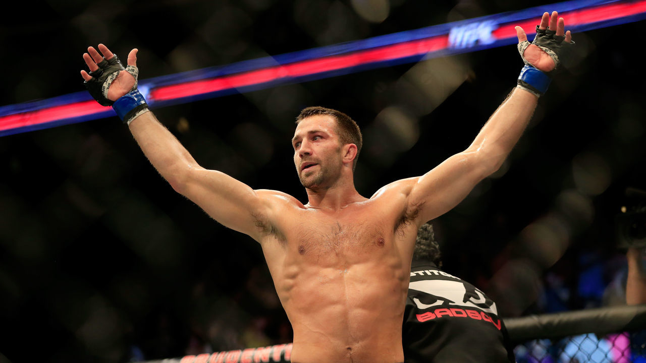 NEWARK, NJ - APRIL 18: Luke Rockhold celebrates defeating Lyoto Machida of Brazil by tap out in their middleweight bout during the UFC Fight Night event at Prudential Center on April 18, 2015 in Newark, New Jersey.