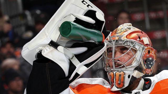 PHILADELPHIA, PA - JANUARY 02: Goalie Michal Neuvirth #30 of the Philadelphia Flyers sprays water on his face against the Pittsburgh Penguins during the third period at Wells Fargo Center on January 2, 2018 in Philadelphia, Pennsylvania.