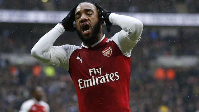 Arsenal's French striker Alexandre Lacazette reacts after missing a chance during the English Premier League football match between Tottenham Hotspur and Arsenal at Wembley Stadium in London, on February 10, 2018. / AFP PHOTO / IKIMAGES / Ian KINGTON / RESTRICTED TO EDITORIAL USE. No use with unauthorized audio, video, data, fixture lists, club/league logos or 'live' services. Online in-match use limited to 45 images, no video emulation. No use in betting, games or single club/league/player publications. /