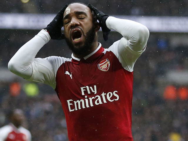 Arsenal's French striker Alexandre Lacazette reacts after missing a chance during the English Premier League football match between Tottenham Hotspur and Arsenal at Wembley Stadium in London, on February 10, 2018. / AFP PHOTO / IKIMAGES / Ian KINGTON / RESTRICTED TO EDITORIAL USE. No use with unauthorized audio, video, data, fixture lists, club/league logos or 'live' services. Online in-match use limited to 45 images, no video emulation. No use in betting, games or single club/league/player publications. /