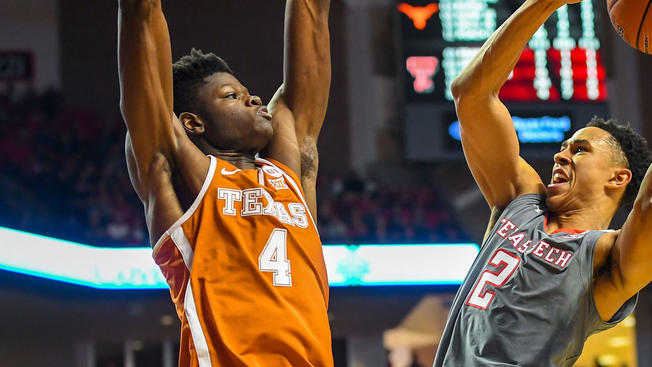 LUBBOCK, TX - JANUARY 31: Zhaire Smith #2 of the Texas Tech Red Raiders goes up for a shot against Nohamed Bamba #4 of the Texas Longhorns during the game on January 31, 2018 at United Supermarket Arena in Lubbock, Texas. Texas Tech defeated Texas 73-71 in overtime.