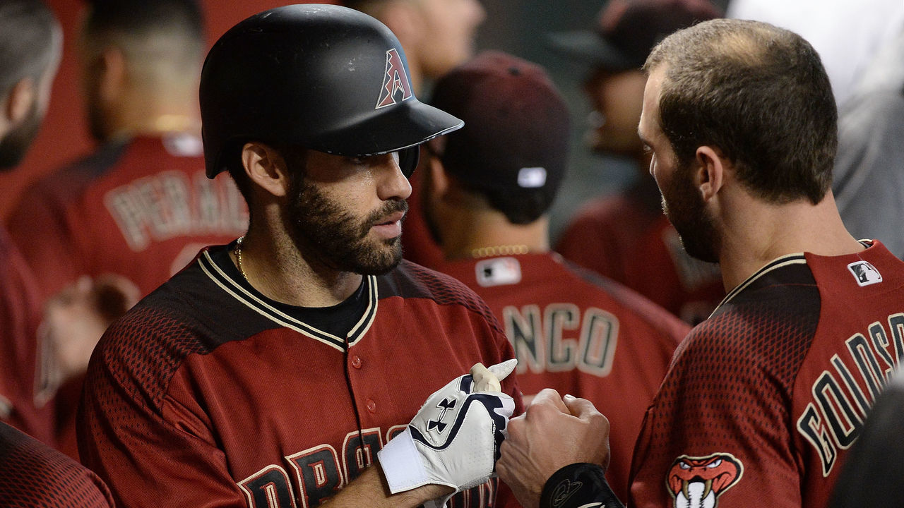 PHOENIX, AZ - SEPTEMBER 10: J.D. Martinez #28 of the Arizona Diamondbacks is congratulated by Paul Goldschmidt #44 after hitting a solo home run in the sixth inning against the San Diego Padres at Chase Field on September 10, 2017 in Phoenix, Arizona.