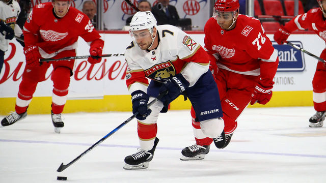 DETROIT, MI - DECEMBER 11: Colton Sceviour #7 of the Florida Panthers heads up ice in front of Andreas Athanasiou #72 of the Detroit Red Wings during the first period at Little Caesars Arena on December 11, 2017 in Detroit, Michigan.