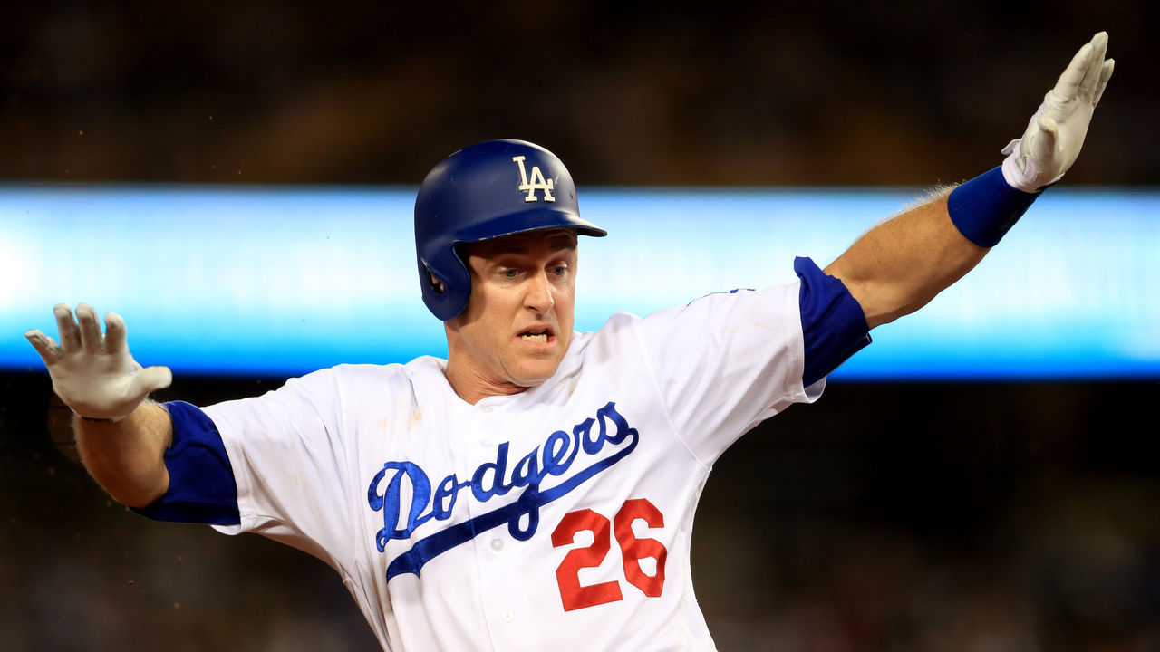 LOS ANGELES, CA - SEPTEMBER 26: Chase Utley #26 of the Los Angeles Dodgers slides into third base during a game against the San Diego Padres at Dodger Stadium on September 26, 2017 in Los Angeles, California.