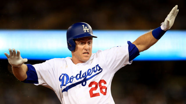 LOS ANGELES, CA - SEPTEMBER 26: Chase Utley #26 of the Los Angeles Dodgers slides into third base during a game against the San Diego Padres at Dodger Stadium on September 26, 2017 in Los Angeles, California.