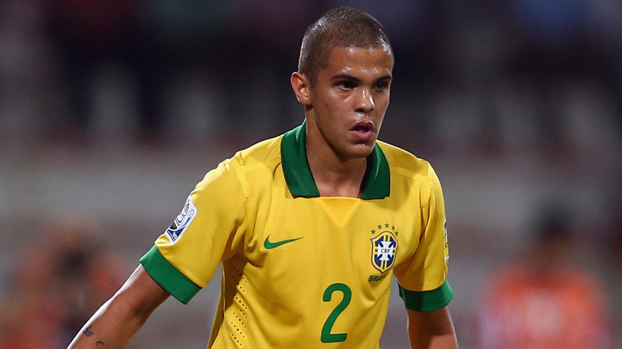 DUBAI, UNITED ARAB EMIRATES - NOVEMBER 01: Auro of Brazil controles the ball during the FIFA U-17 World Cup UAE 2013 Quarter Final match between Brazil and Mexico at Al Rashid Stadium on November 1, 2013 in Dubai, United Arab Emirates.