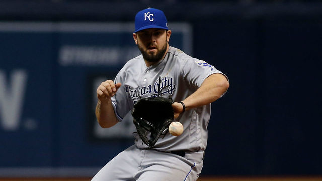 ST. PETERSBURG, FL - MAY 10: Third baseman Mike Moustakas #8 of the Kansas City Royals fields a ball that went for a single off the bat of Brad Miller of the Tampa Bay Rays during the eighth inning of a game on May 10, 2017 at Tropicana Field in St. Petersburg, Florida.