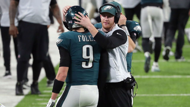 MINNEAPOLIS, MN - FEBRUARY 04: Nick Foles #9 of the Philadelphia Eagles is congratulated by his teammate Carson Wentz #11 after his 11-yard touchdown pass during the fourth quarter against the New England Patriots in Super Bowl LII at U.S. Bank Stadium on February 4, 2018 in Minneapolis, Minnesota.