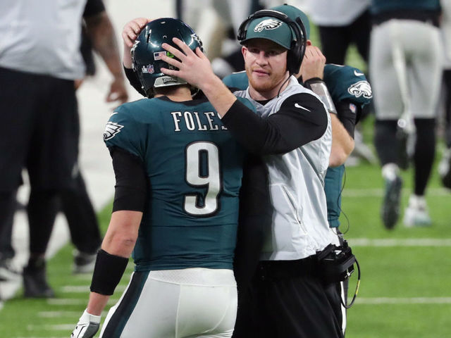 MINNEAPOLIS, MN - FEBRUARY 04: Nick Foles #9 of the Philadelphia Eagles is congratulated by his teammate Carson Wentz #11 after his 11-yard touchdown pass during the fourth quarter against the New England Patriots in Super Bowl LII at U.S. Bank Stadium on February 4, 2018 in Minneapolis, Minnesota.