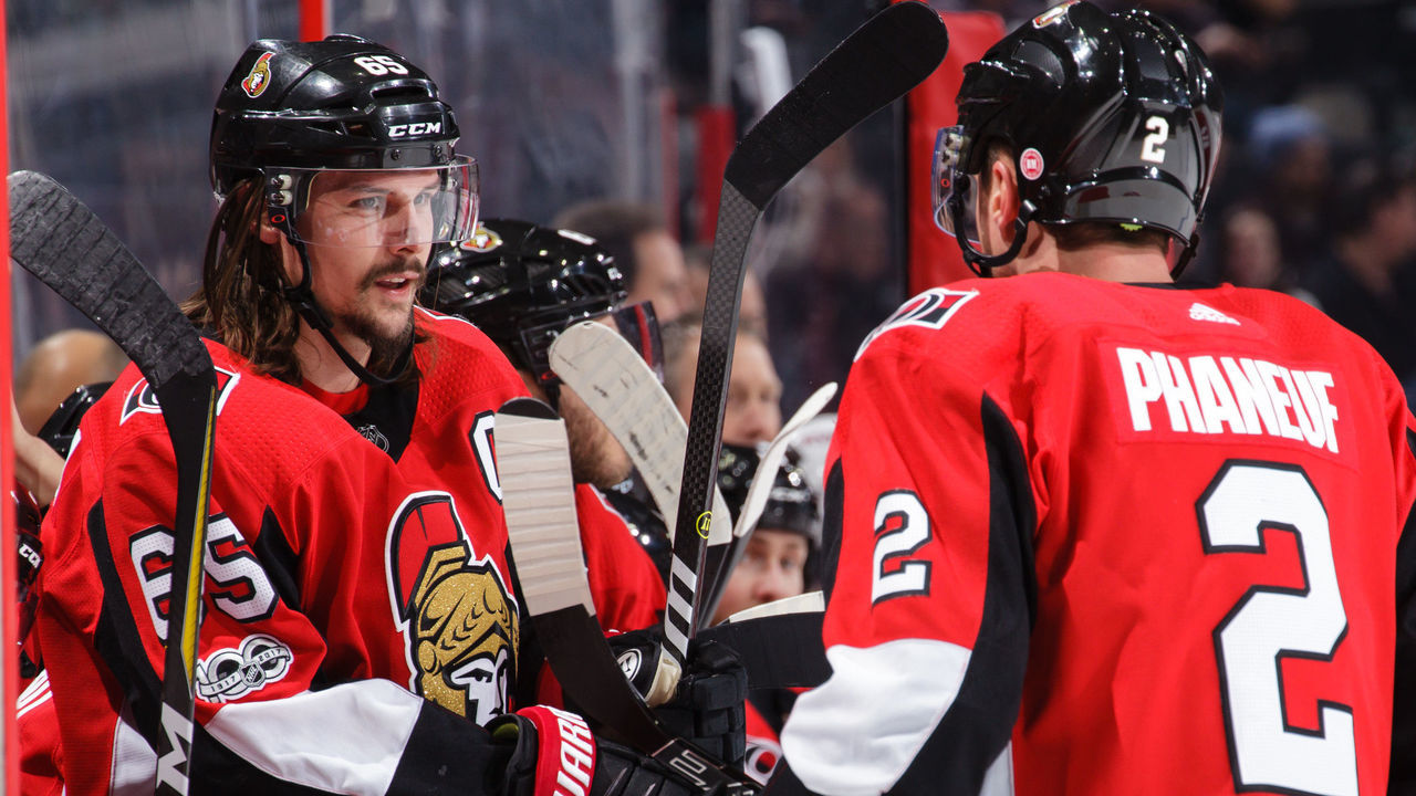 OTTAWA, ON - DECEMBER 4: Erik Karlsson #65 of the Ottawa Senators chats with Dion Phaneuf #2 during a break in a game against the New York Rangers at Canadian Tire Centre on December 4, 2017 in Ottawa, Ontario, Canada.