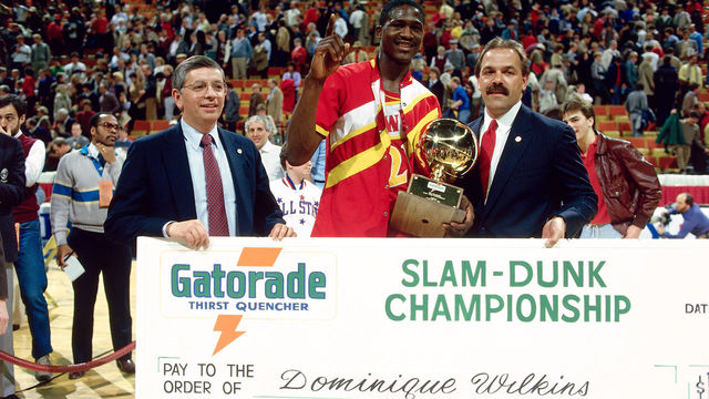 29 Jan. 1984: Doninique Wilkins #21 of the Atlanta Hawks poses with David Stern as he receives his check from the sponser of the Slam Dunk Contest during the NBA All Star Weekend in Denver, Colorado. NOTE TO USER: User expressly acknowledges and agrees that, by downloading and/or using this Photograph, User is consenting to the terms and conditions of the Getty Images License Agreement. Mandatory copyright notice and Credit: Copyright 2001 NBAE Mandatory Credit:Andrew D. Bernstein/NBAE/Getty Images