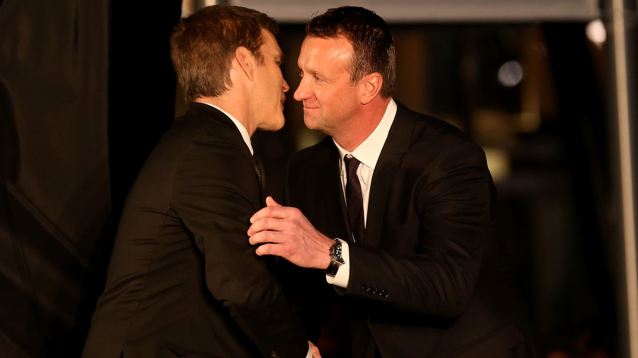 LOS ANGELES, CA - MARCH 07: Hockey Hall of Famerand Los Angeles Kings legend Luc Robitaille greets former teammate Rob Blake during ceremonies unveiling a statue of Robitaille on Star Plaza in front of Staples Center before the game between the Kings and the Pittsburgh Penguins on March 7, 2015 in Los Angeles, California.