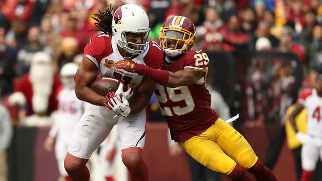 LANDOVER, MD - DECEMBER 17: Wide Receiver Larry Fitzgerald #11 of the Arizona Cardinals is tackled by cornerback Kendall Fuller #29 of the Washington Redskins in the first quarter at FedEx Field on December 17, 2017 in Landover, Maryland.