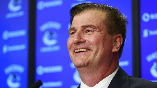 VANCOUVER, BC - MAY 23: Vancouver Canucks new General Manager smiles during a press conference at Rogers Arena May 23, 2014 in Vancouver, British Columbia, Canada.