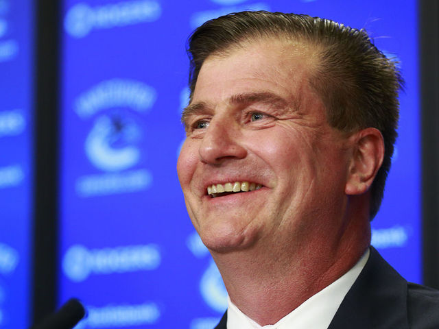 VANCOUVER, BC - MAY 23: Vancouver Canucks new General Manager smiles during a press conference at Rogers Arena May 23, 2014 in Vancouver, British Columbia, Canada.
