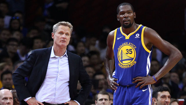 SHENZHEN, CHINA - OCTOBER 05: Head coach Steve Kerr of the Golden State Warriors speaks to Kevin Durant #35 during the game between the Minnesota Timberwolves and the Golden State Warriors as part of 2017 NBA Global Games China at Universidade Center on October 5, 2017 in Shenzhen, China.